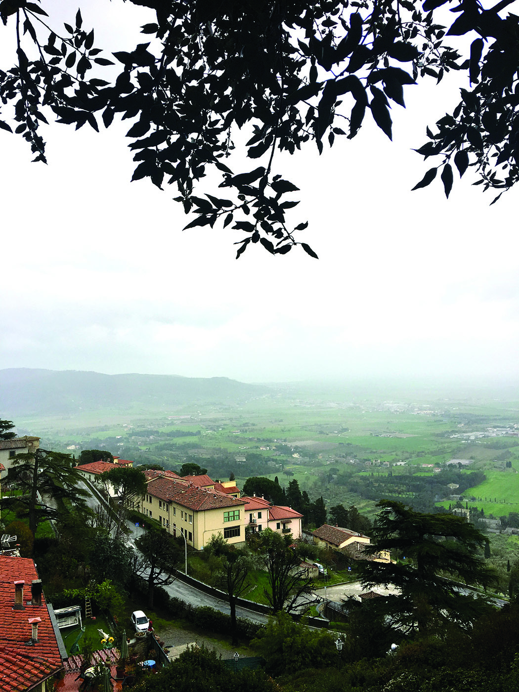 Apsnūdusi nuo lietaus Cortona.