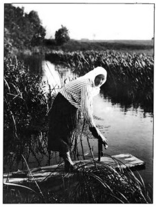 A Lithuanian peasant woman washing linen in a brook. (Turn of the century photograph.)