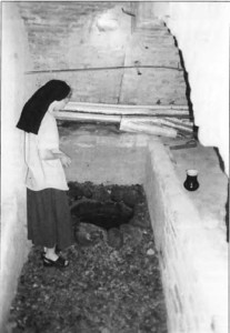 Sister Dalia shows the well in the cellar underneath the church from which the natural spring has flown for centuries. 