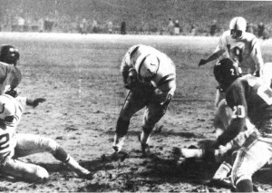 One of the most famous sports photographs ever depicts Johnny Unitas at the instant football's greatest game of all time ended. Unitas was named the game's most valuable player. 