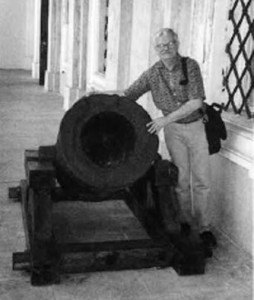 The author with an ancient cannon guarding the castle's entrance. 