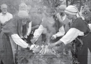 Lighting a ritual fire during a Rasos celebration.