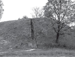The Geruliai hillfort with wooden stairs leading to its top.