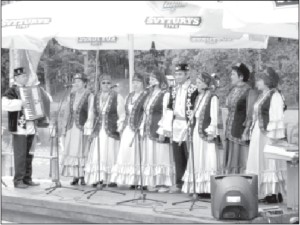  A Tatar singing group performs at a festival in a Vilnius park.