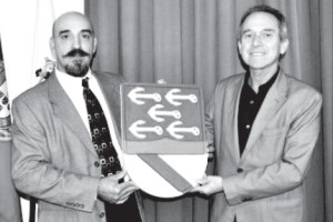 Manuel Rosa (left) presents Columbus’s coat of arms that he located in 2001 to Carlos Calado, President of the Association Cristóbal Colón of Portugal