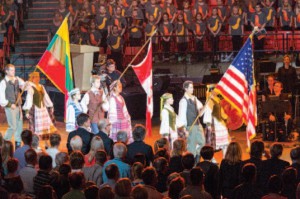 All rise as the flags of the United States of America, Canada and Lithuania enter the UIC Pavilion. (Photo by A. Zabulionis)