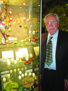 Stanley in his museum with an Easter egg exhibit.