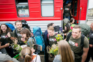 Mission Siberia participants are greeted with flowers upon their return to Vilnius.