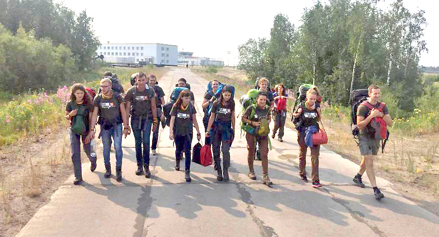 Mission Siberia participants making their way to a Lithuanian cemetery.