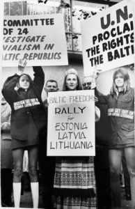 Nancy Umbrazas (center) with other Baltic youths protest at the UN.