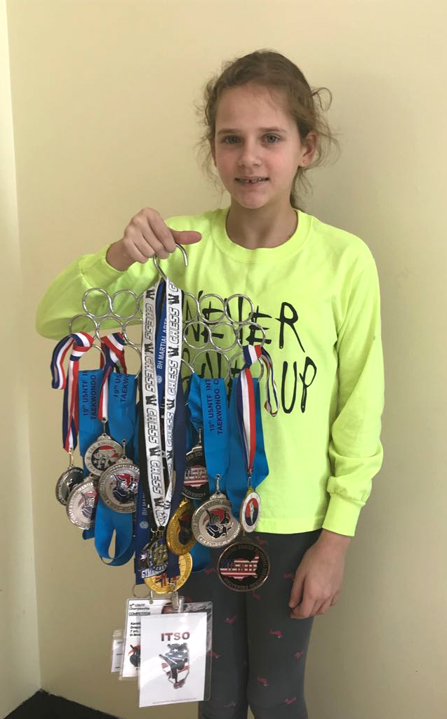 Karolina su dalim taekwondo varžybose iškovotų medalių.